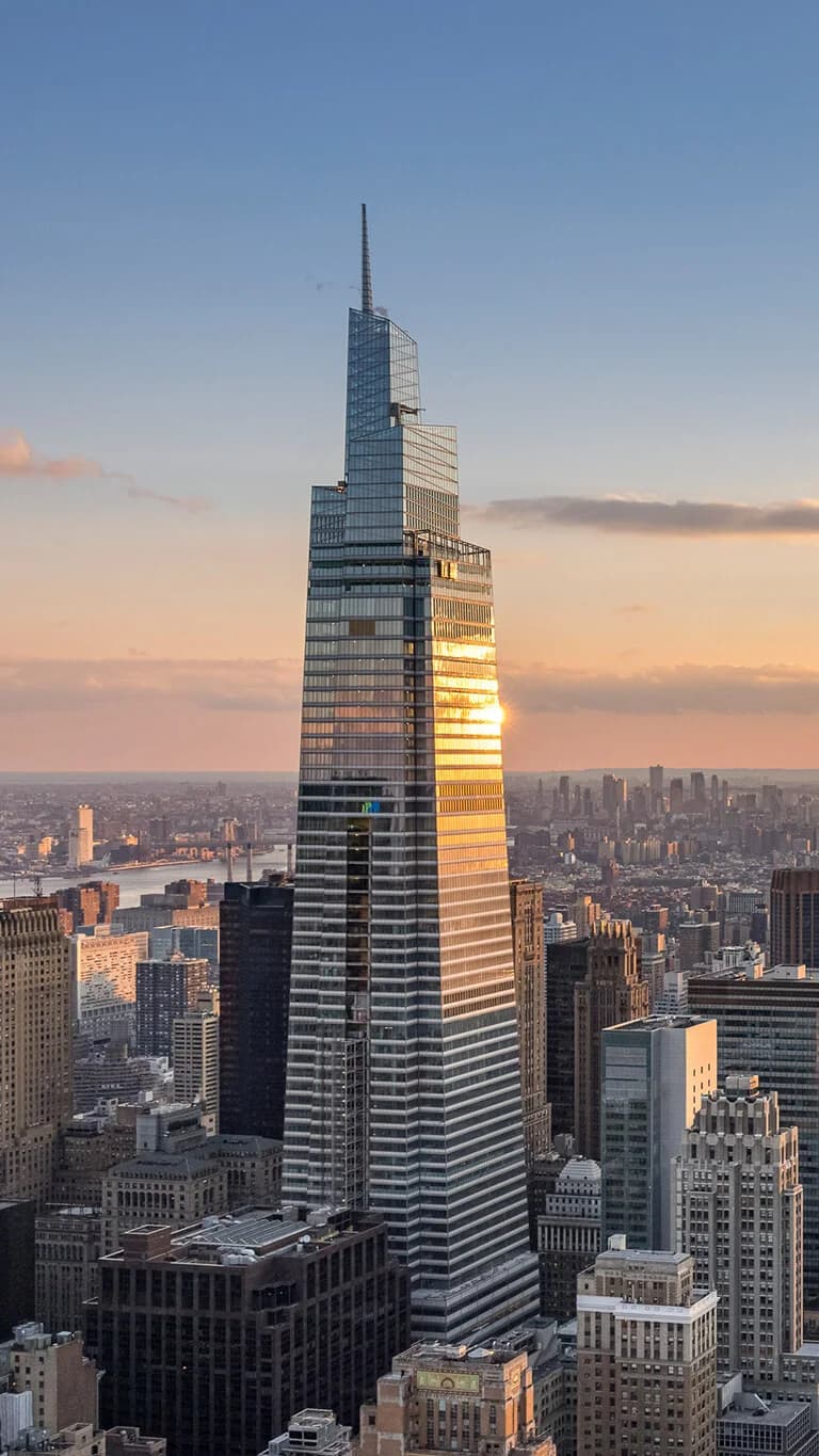 One Vanderbilt tower at sunset over the Manhattan skyline
