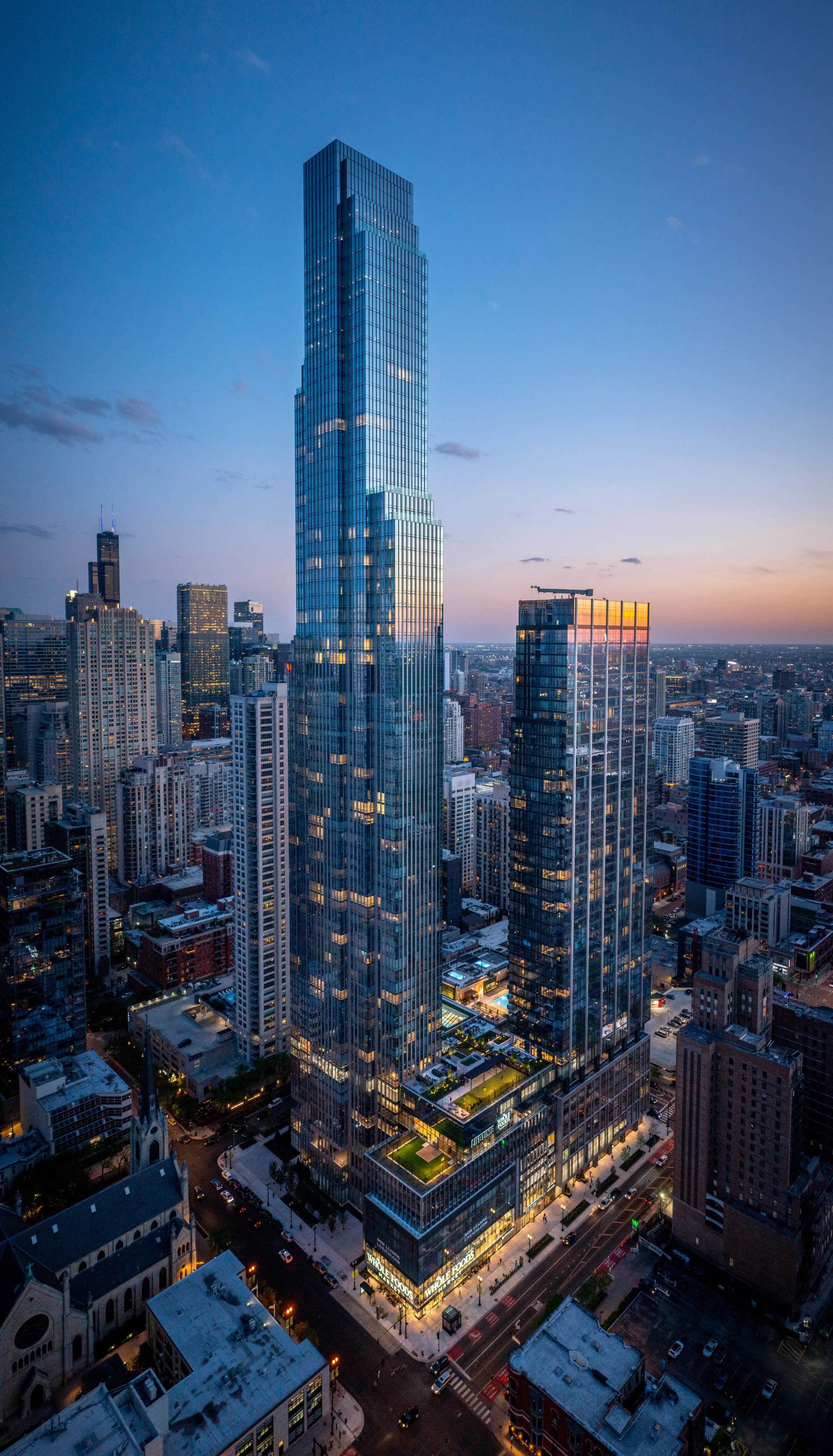Brick residential tower at dusk