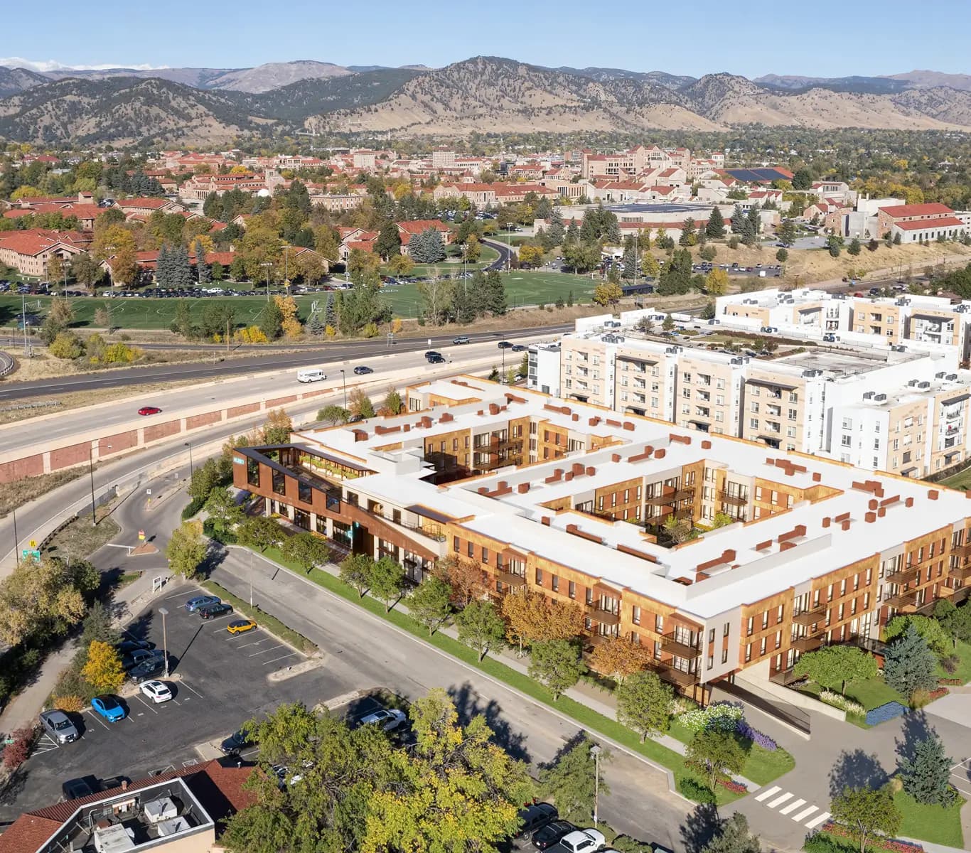 Aerial rendering of HUB Boulder with the foothills behind