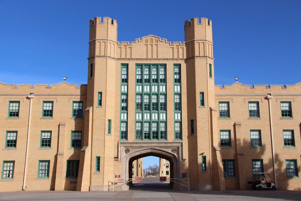 New Mexico Military Institute dormitory with twin castle-style towers and a central archway
